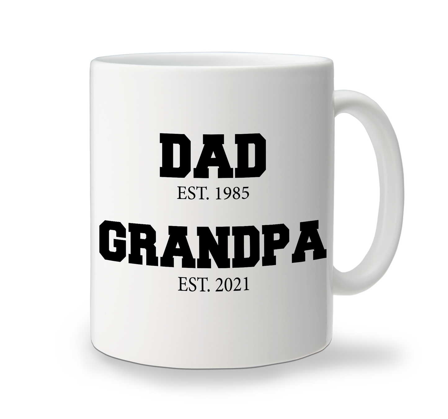 A white custom cofee mug with black text that reads 'DAD EST. 1985' and 'GRANDPA EST. 2021'.
