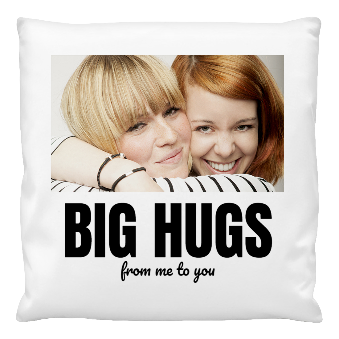 A personalised cushion cover featuring a photo of two people embracing, with the text 'BIG HUGS from me to you' printed on it.
