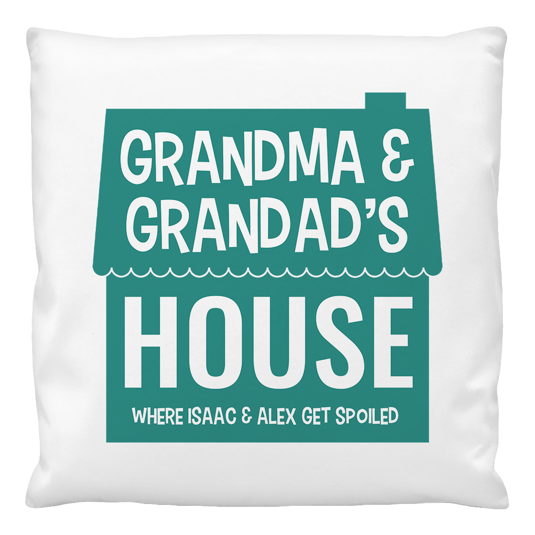 A white cushion cover with the text 'GRANDMA & GRANDPAS'S HOUSE WHERE ISAAC & ALEX GET SPOILED' printed in green.