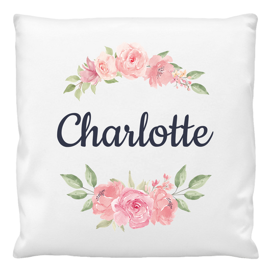 A cushion cover with a floral design and the name 'Charlotte' printed in the center.