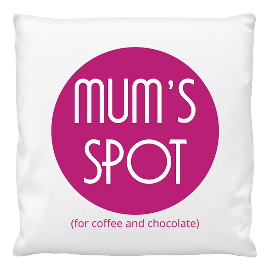 A white custom cushion cover with 'MUM'S SPOT (for coffee and chocolate)' printed in a pink circle.
