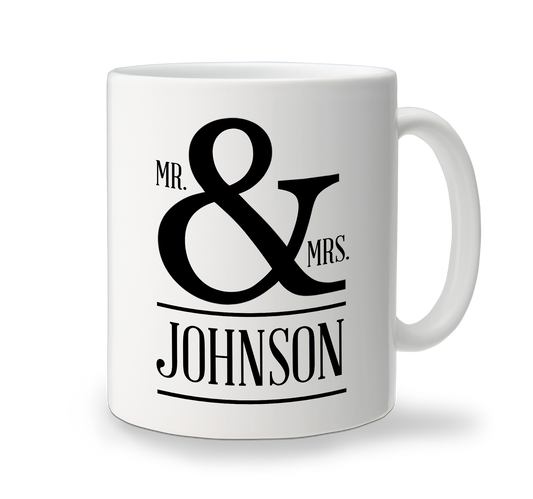 A white custom ceramic mug for wedding with the text 'MR & MRS JOHNSON' printed in black.